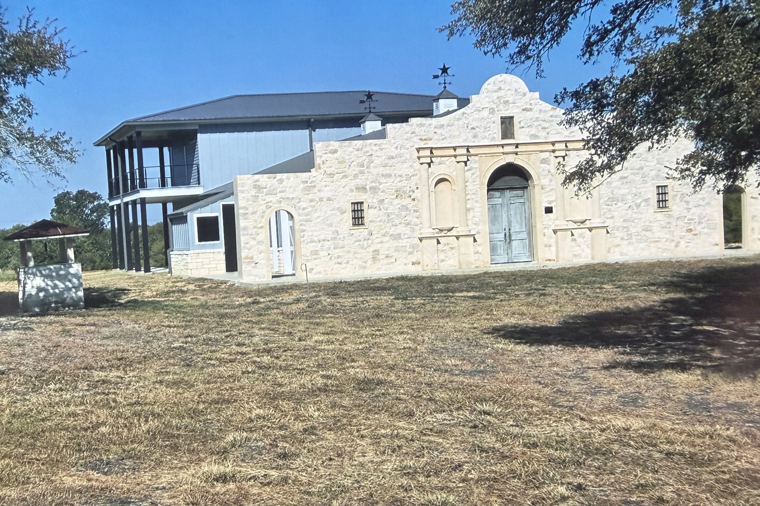 Front of the three-quarter scale Alamo facade under live oaks near Fayetteville, built by Cross Creek