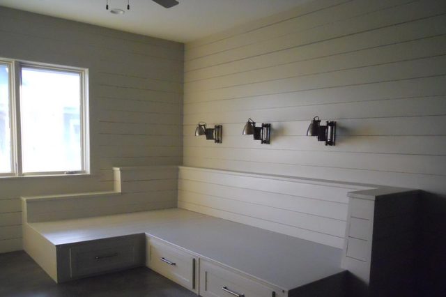 Built-in bunk room with shiplap walls inside a guest casita