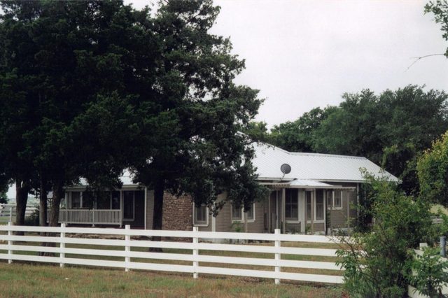 Renovated country home with a white board fence