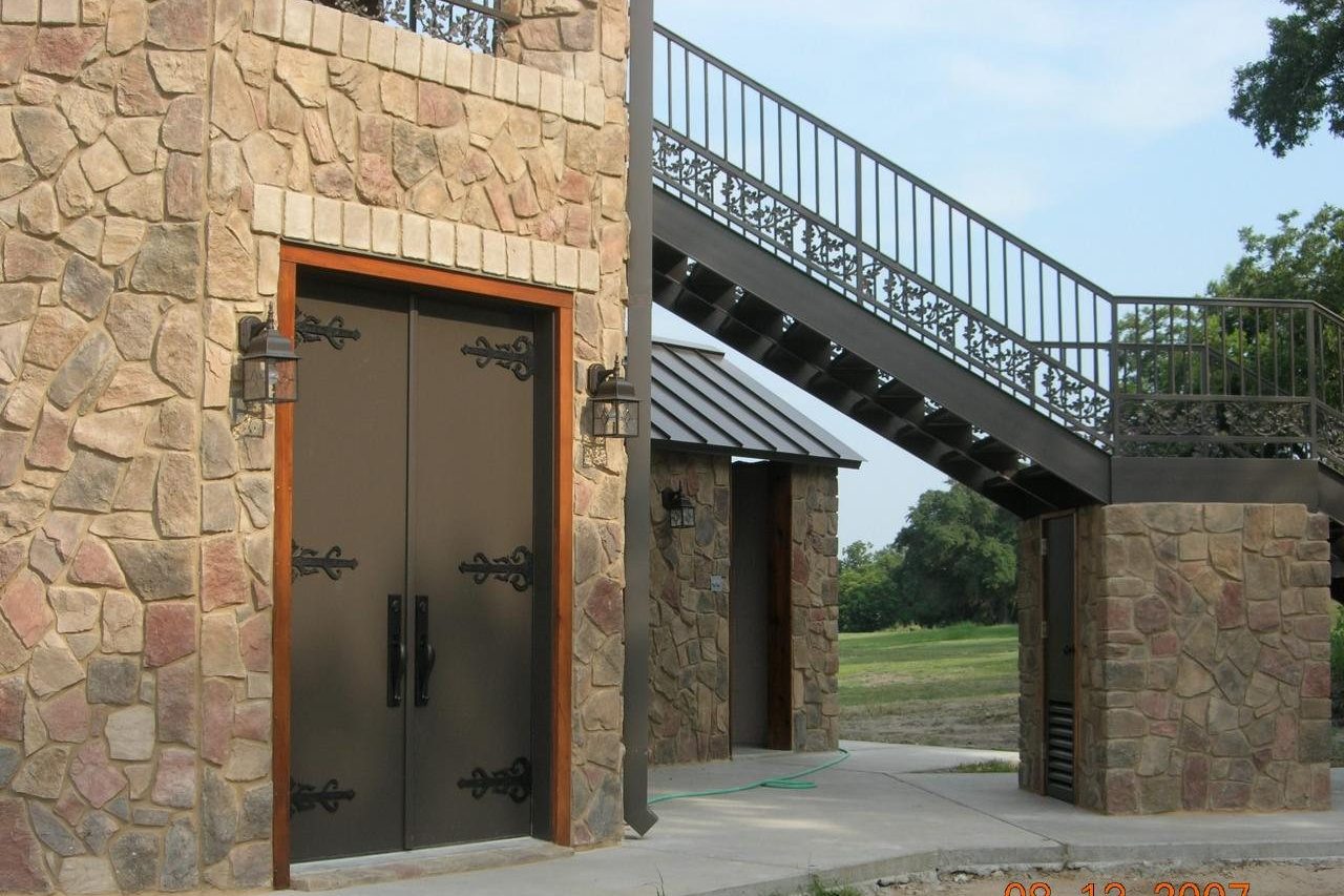 Stone gazebo with metal roof built by Cross Creek