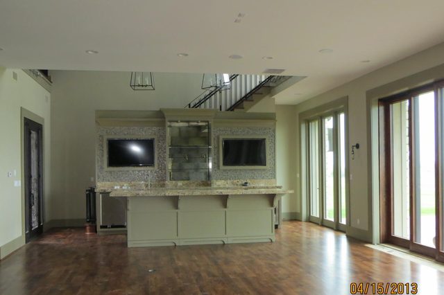 Custom bar and open living space in the Perma Vista home