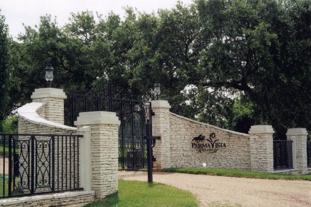 Custom rock and iron gated ranch entry built by Cross Creek