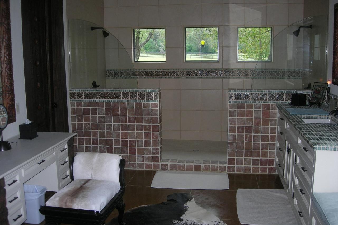 Remodeled master bathroom with custom tile and garden windows