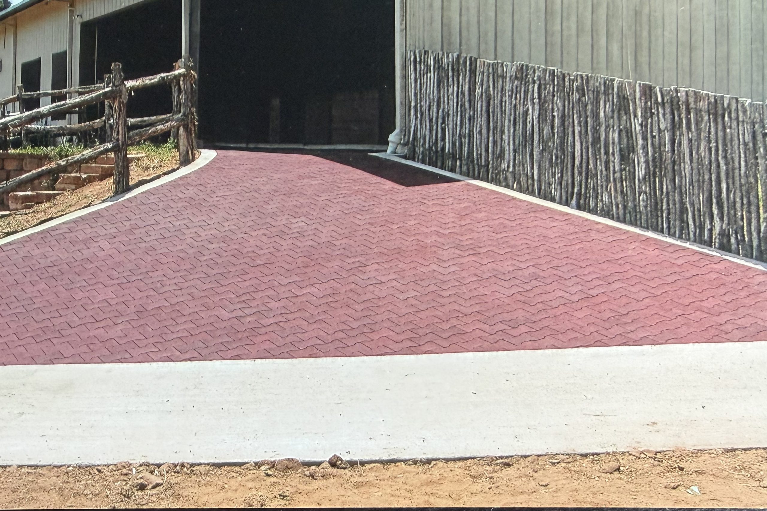 Rubber paver drive at a barn entrance, installed by Cross Creek