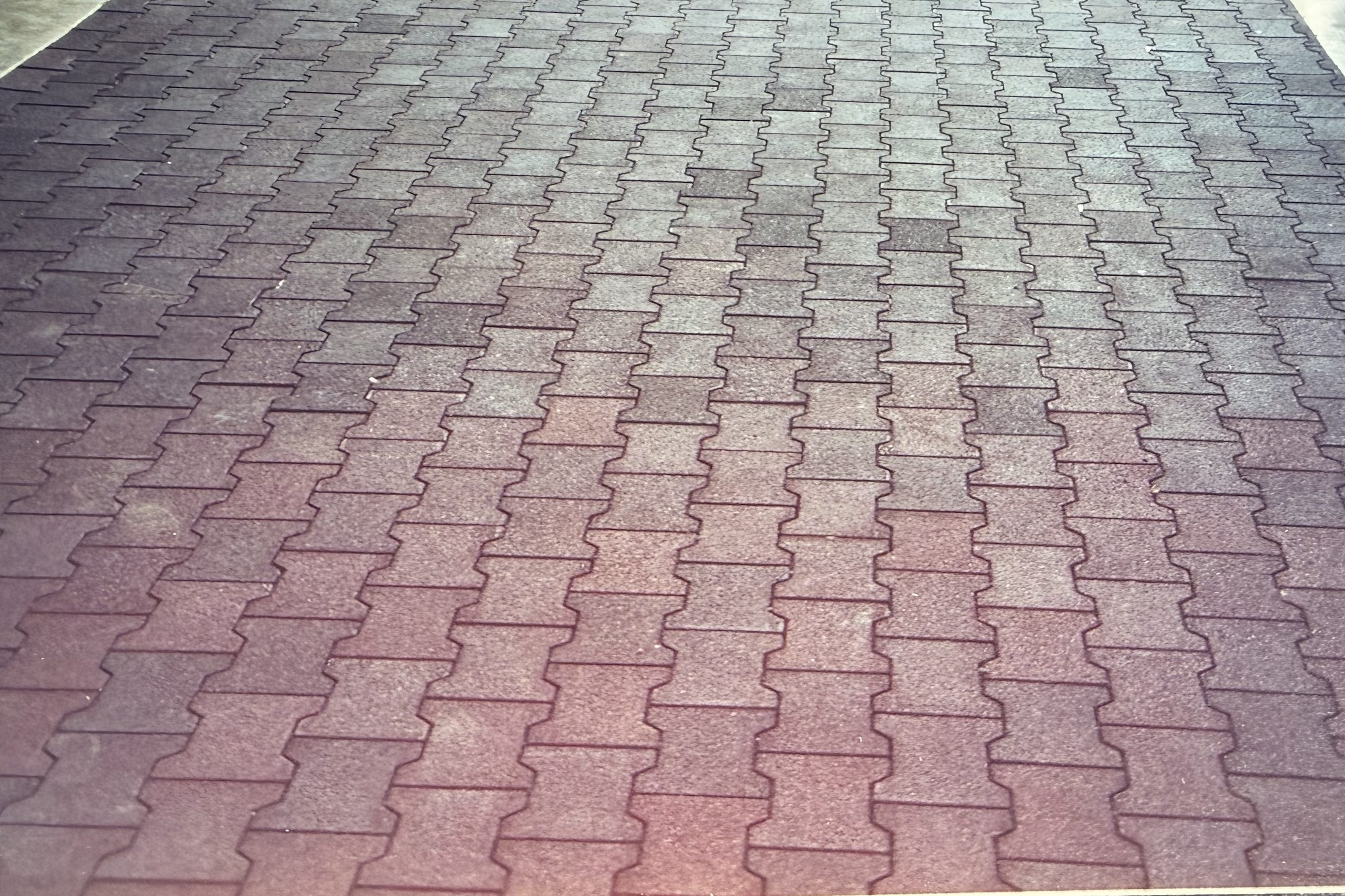 Close view of interlocking rubber pavers, installed by Cross Creek