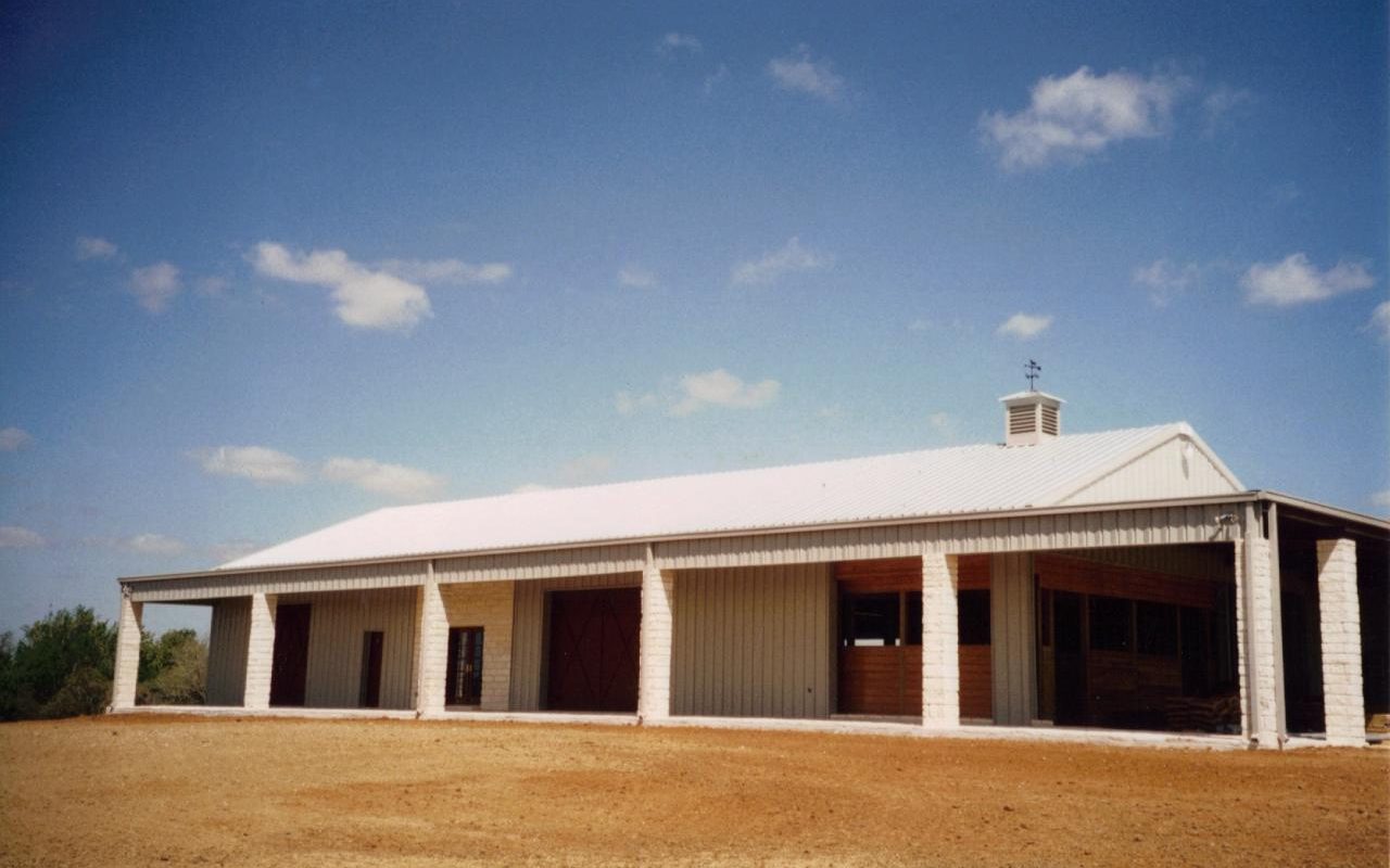 Long white stable with office and party room