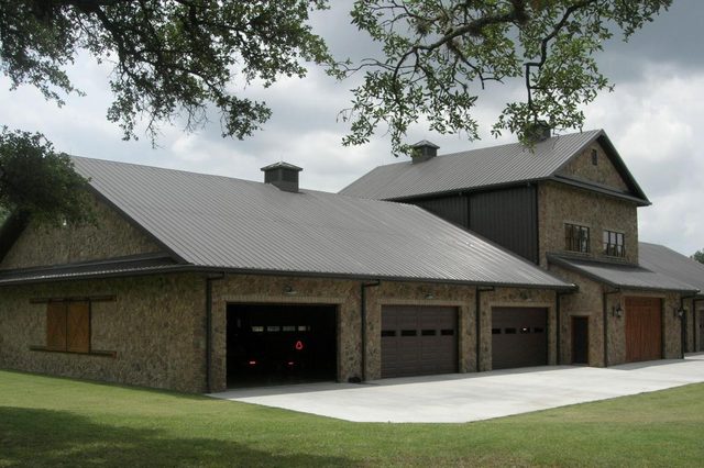 Stone equipment barn with upper level built by Cross Creek