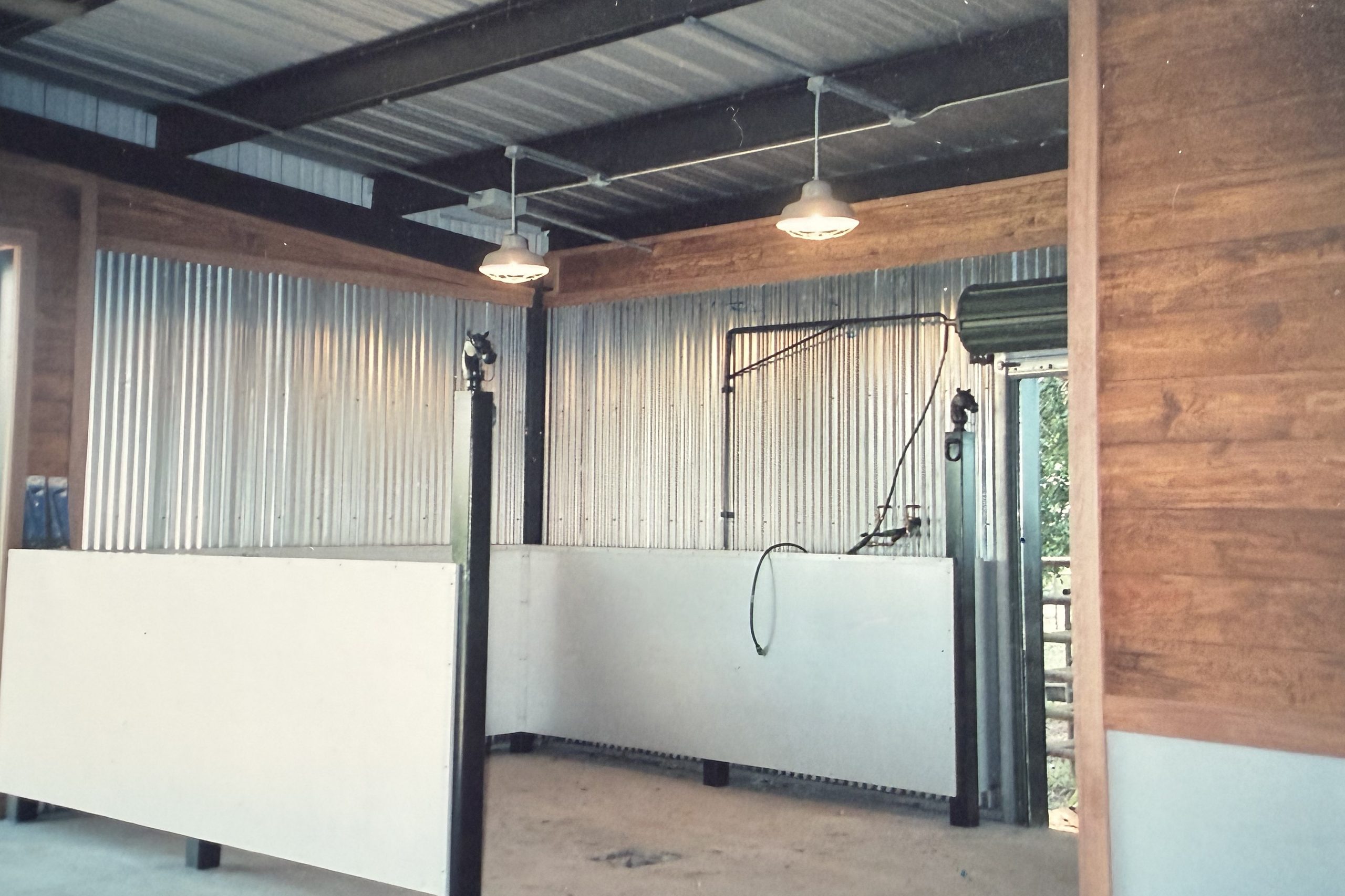 Wash bay with wood paneling and metal walls, built by Cross Creek